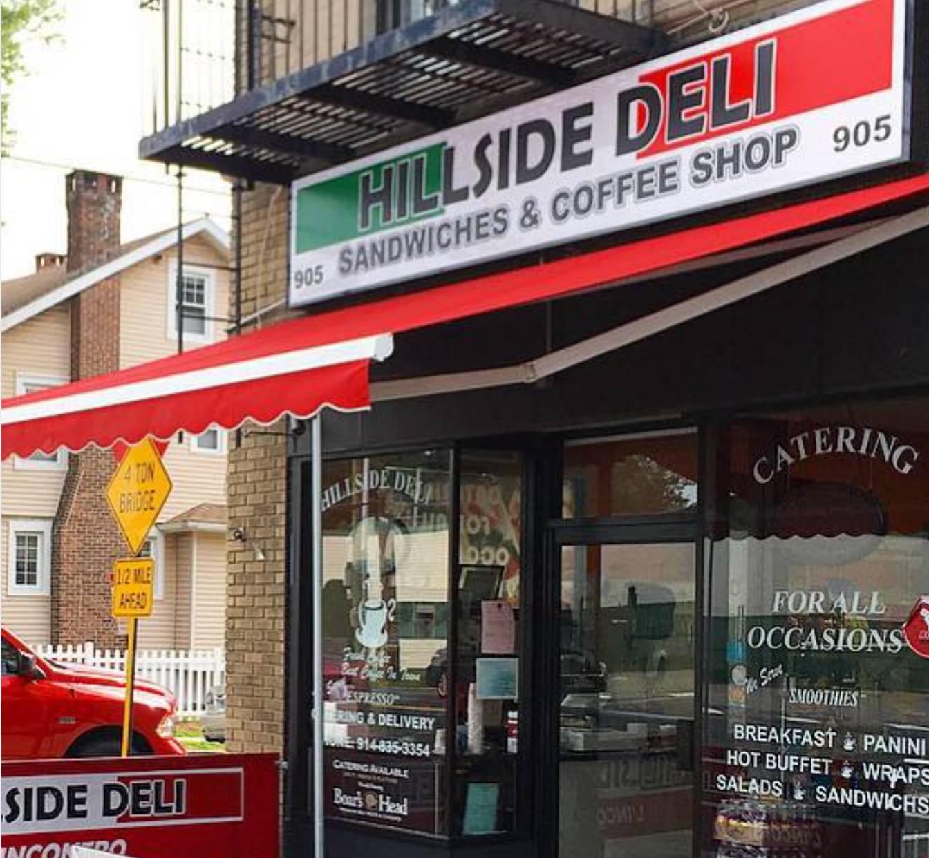 Exterior Of Hillside Deli, A Sandwich And Coffee Shop With A Red Aawning | Motorwerks Inc
