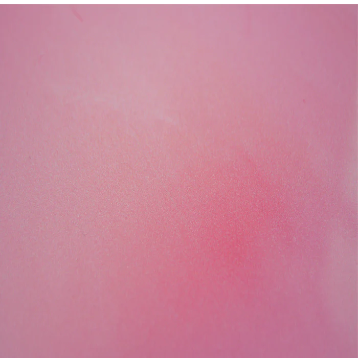 A close up of a pink background with a blurred effect.