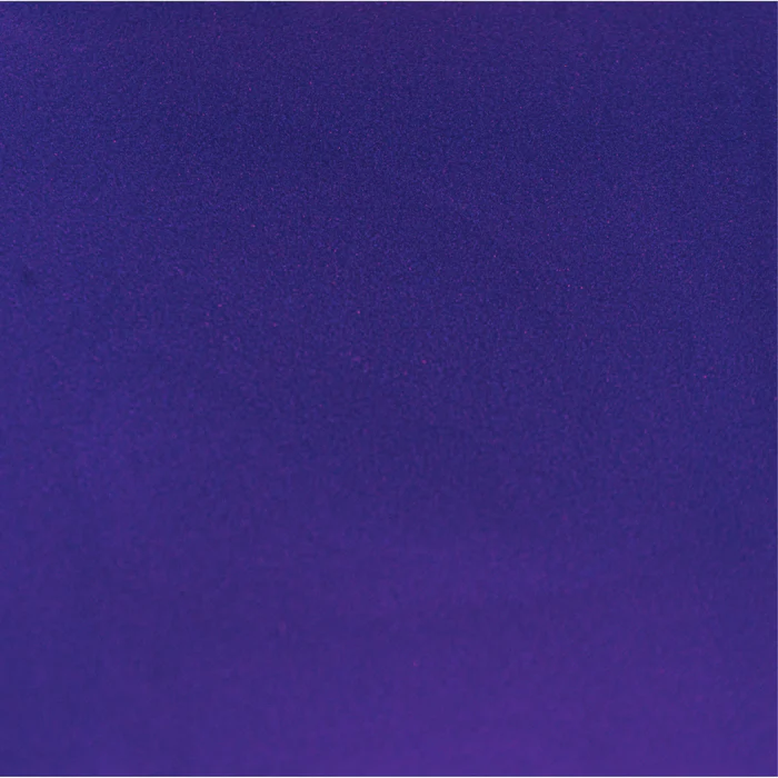 A close up of a purple background with a grainy texture.