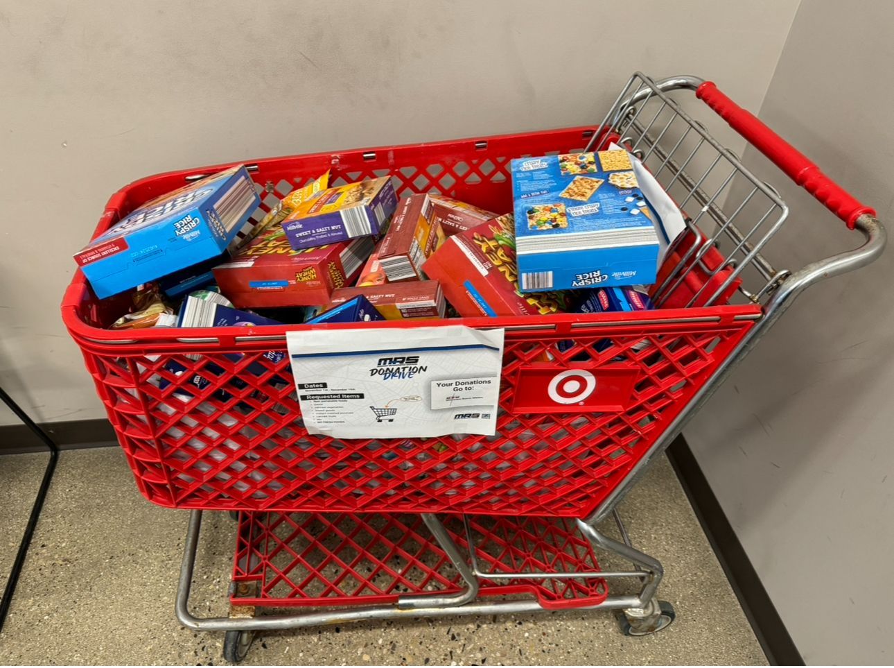 A photo of a cart full of donated food from our Brown Deer Rd location.