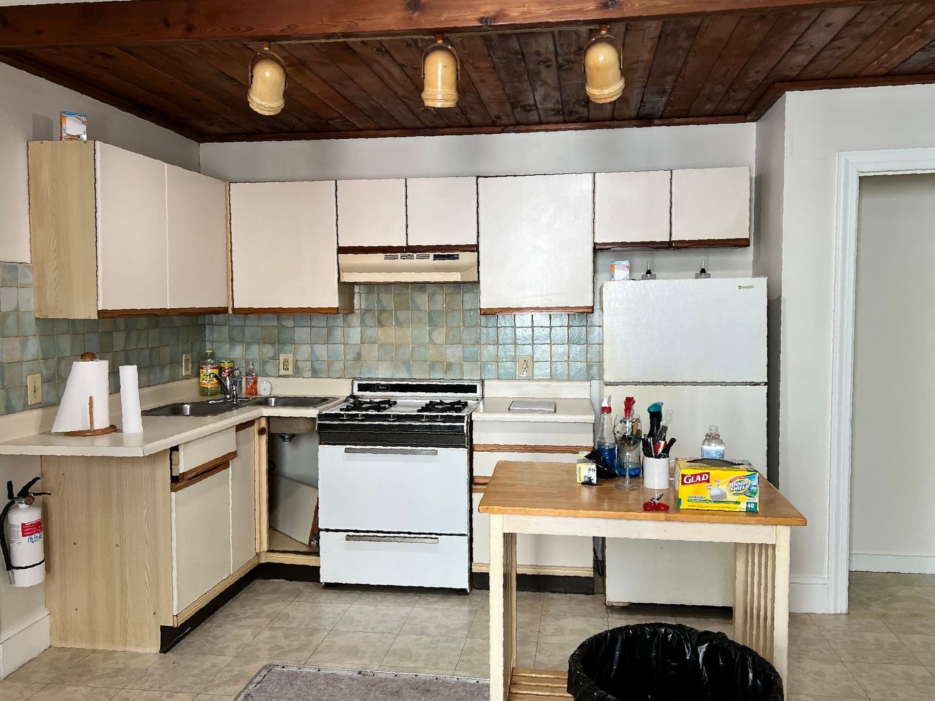 Cape May  Bayside Love rental  kitchen with white cabinets and a white refrigerator