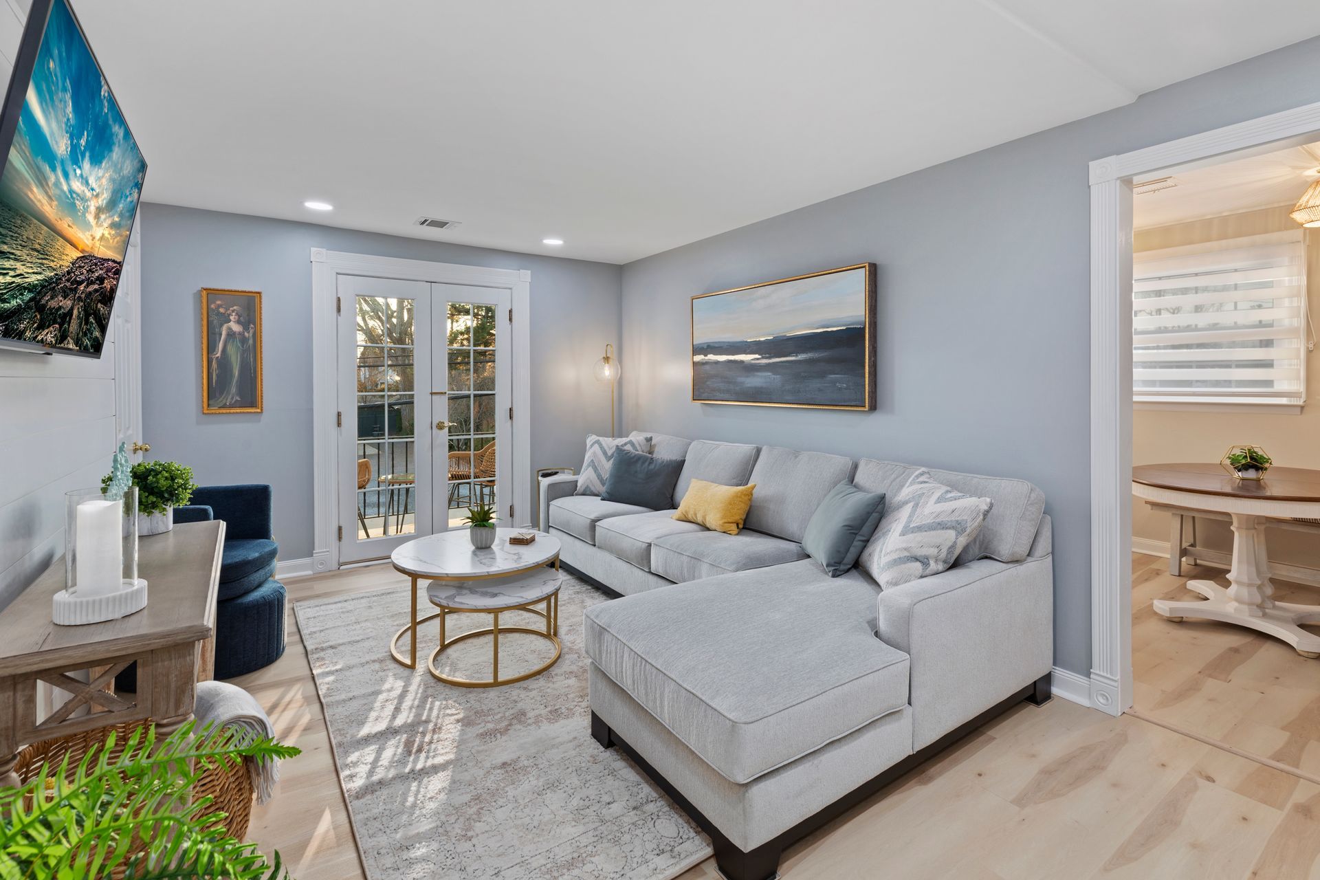 A living room with a couch , table and television.