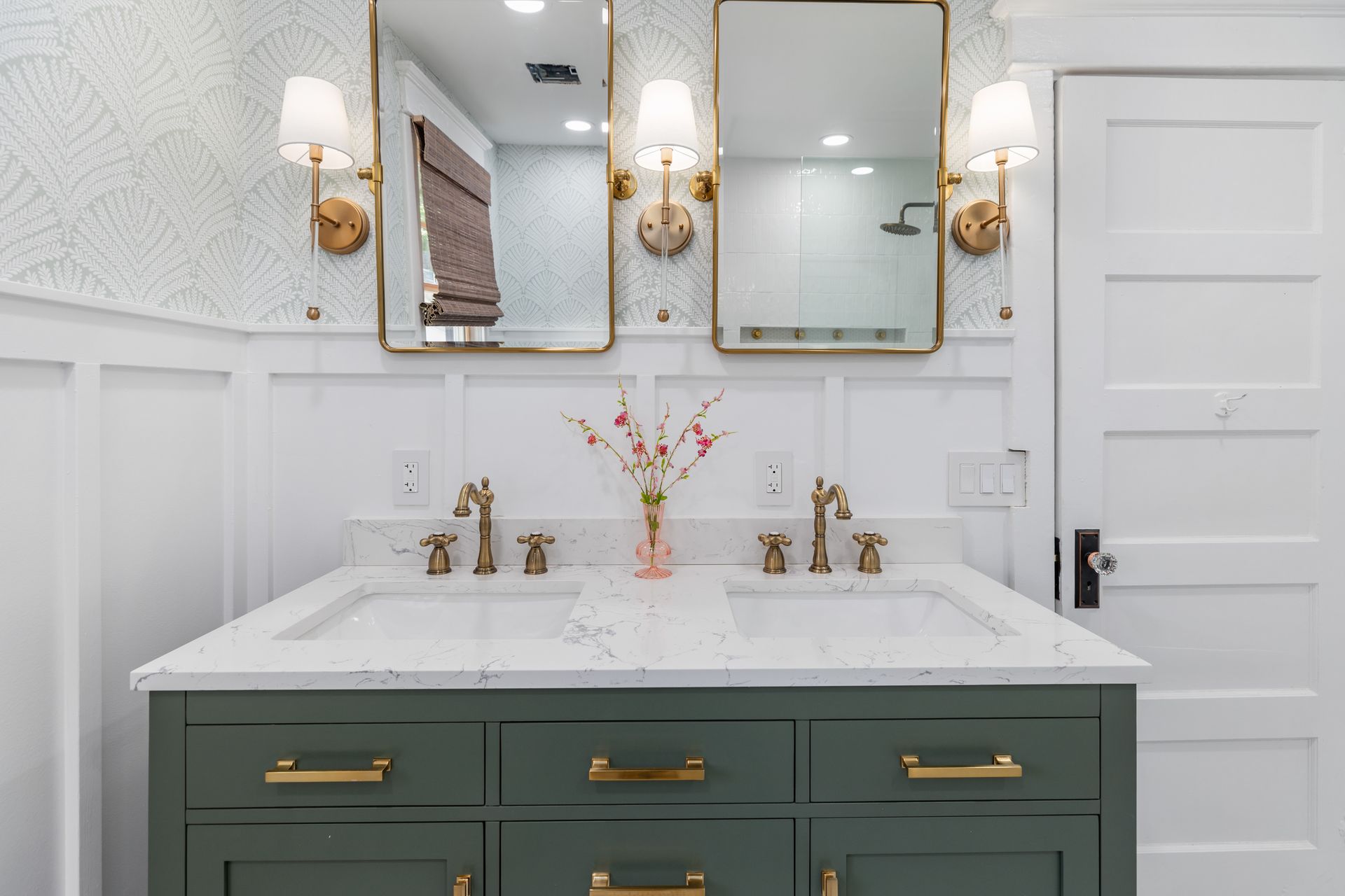 A bathroom with two sinks and two mirrors.