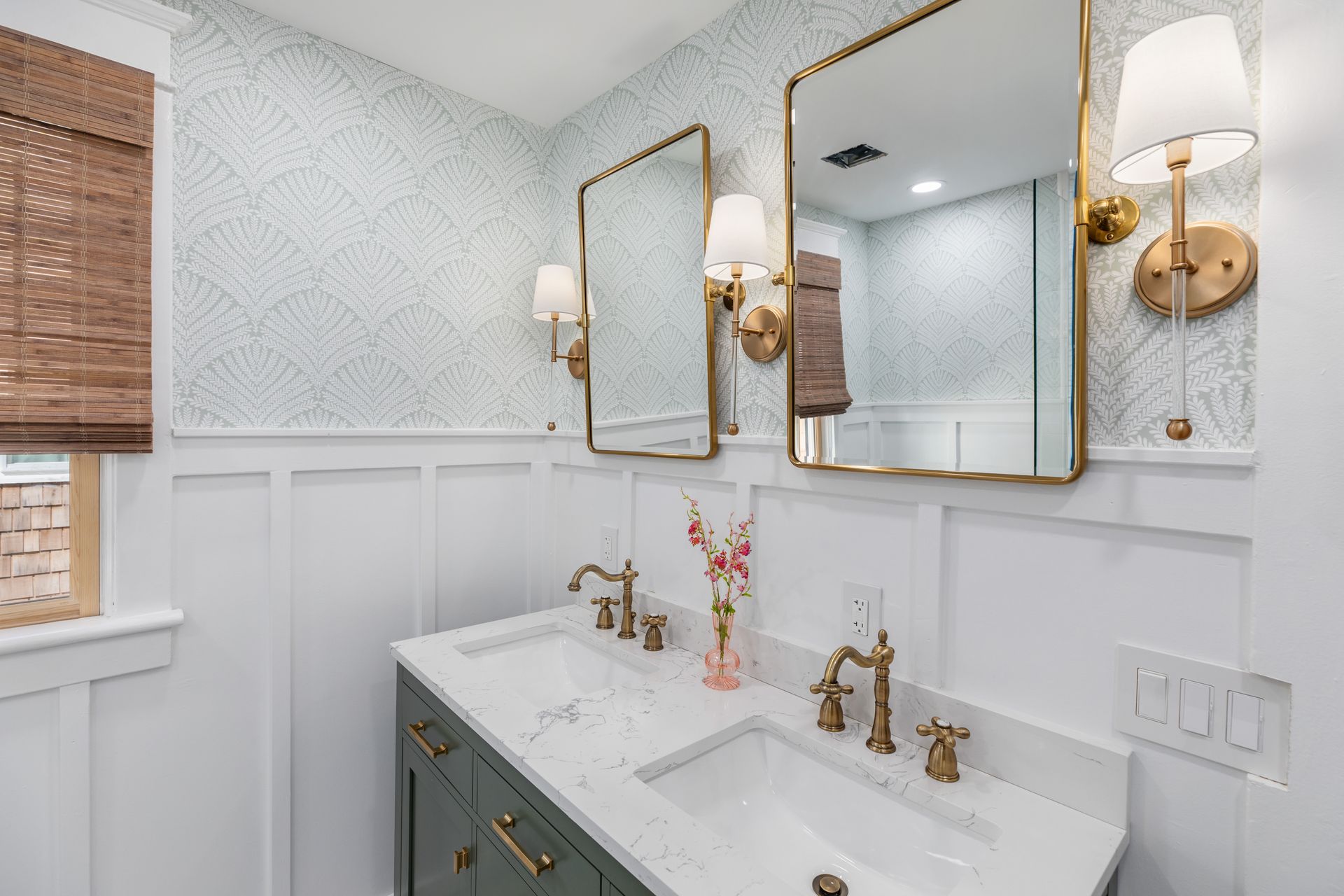 A bathroom with two sinks and two mirrors.