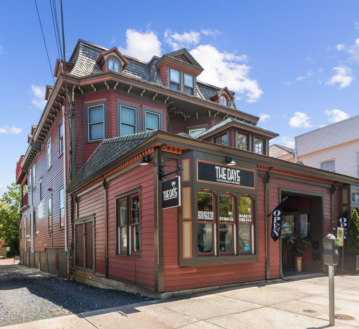 Cape May  Bayside Love rental large red building with a sign that says the dogs