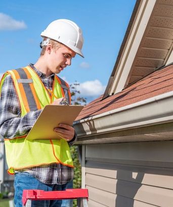 Home inspector providing an inspection to a house