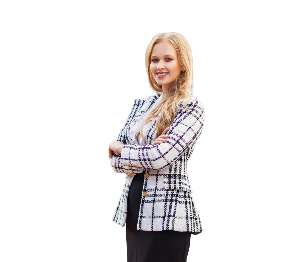 A woman in a plaid jacket is standing with her arms crossed.
