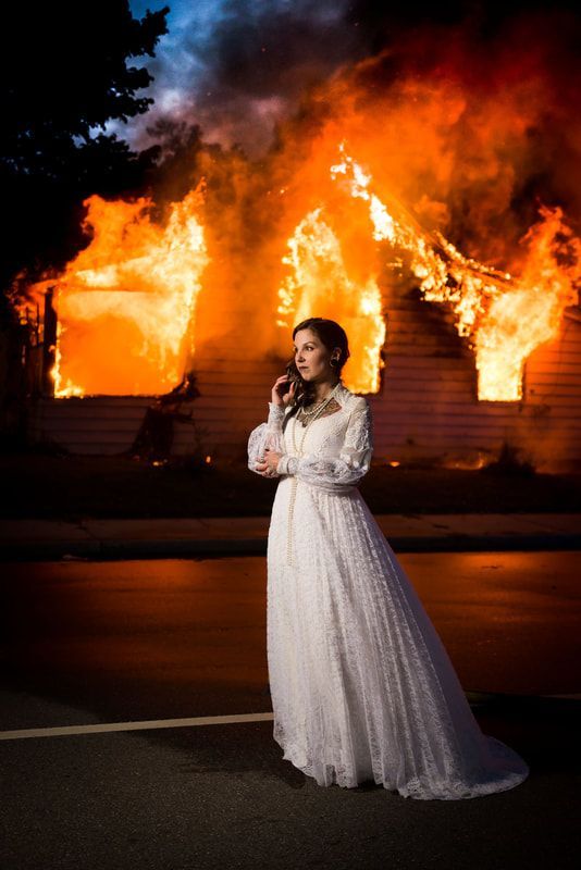 A woman in front of fire