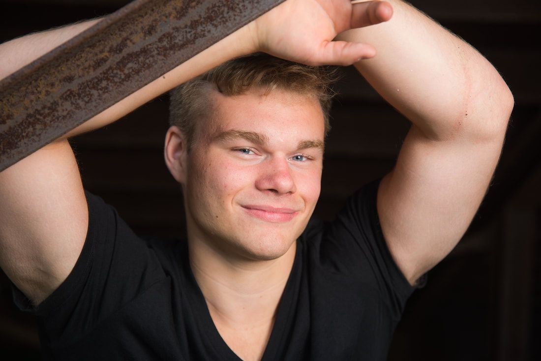 A man smiling in front of camera