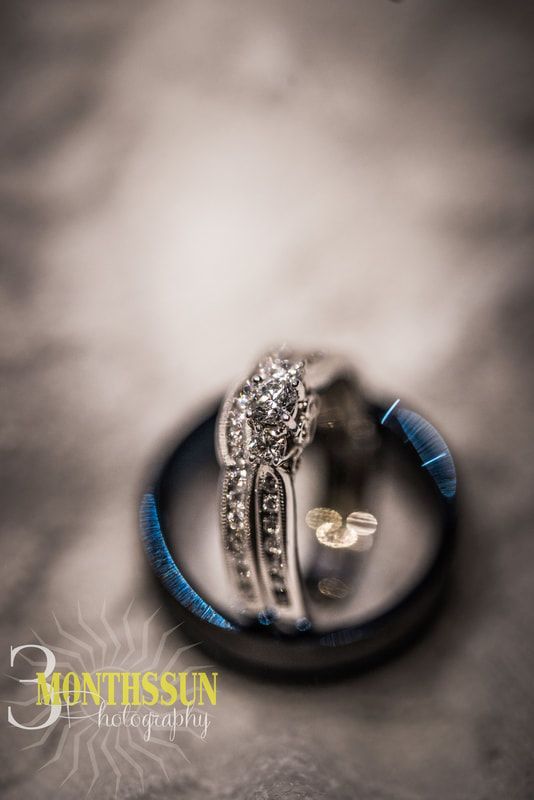 A couple of wedding rings sitting on top of each other