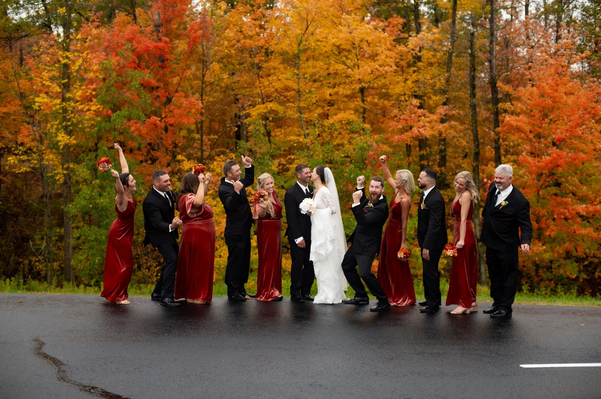 A bride and her bridesmaids are posing for a picture.