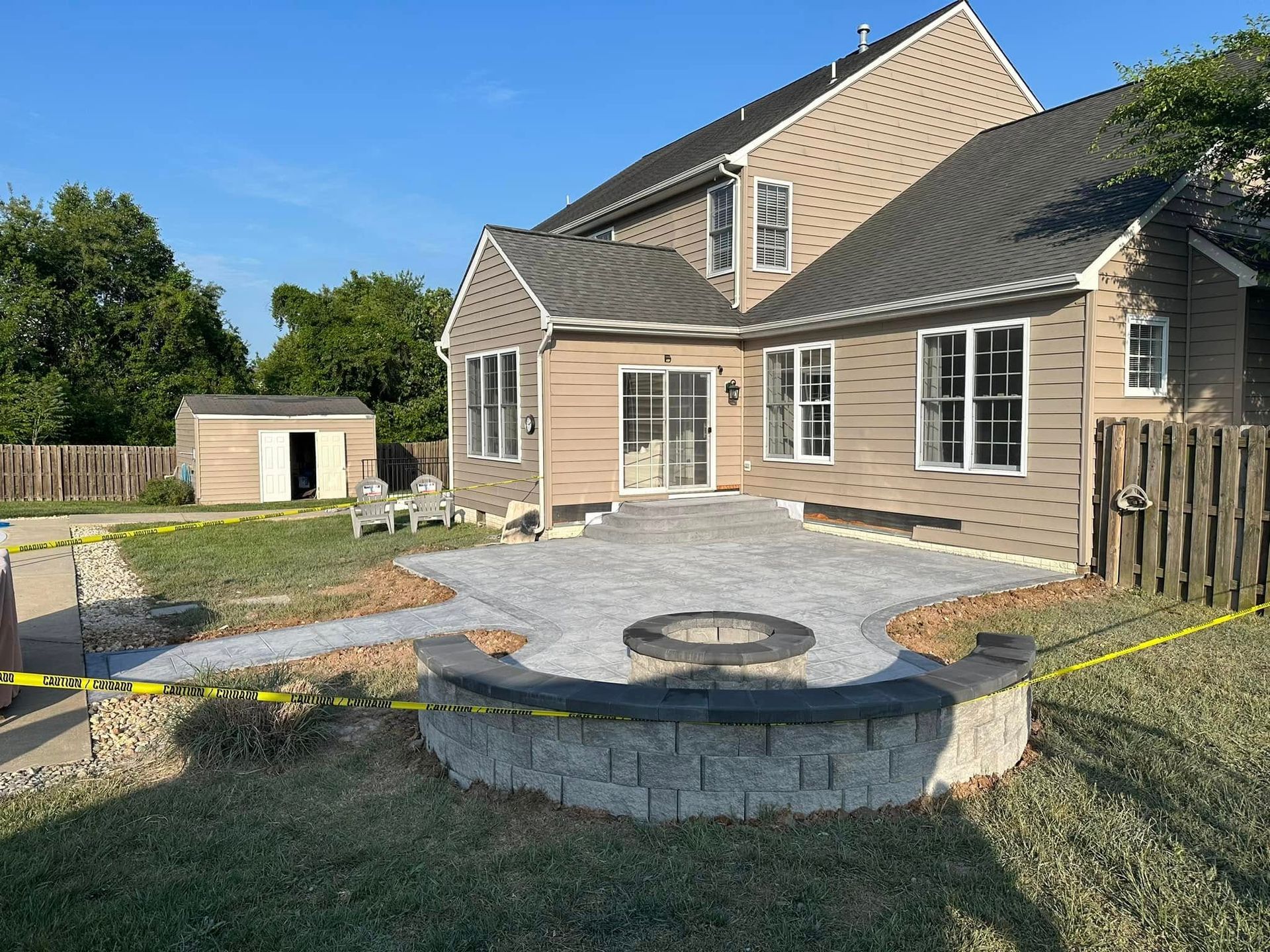 A house with a fire pit in front of it