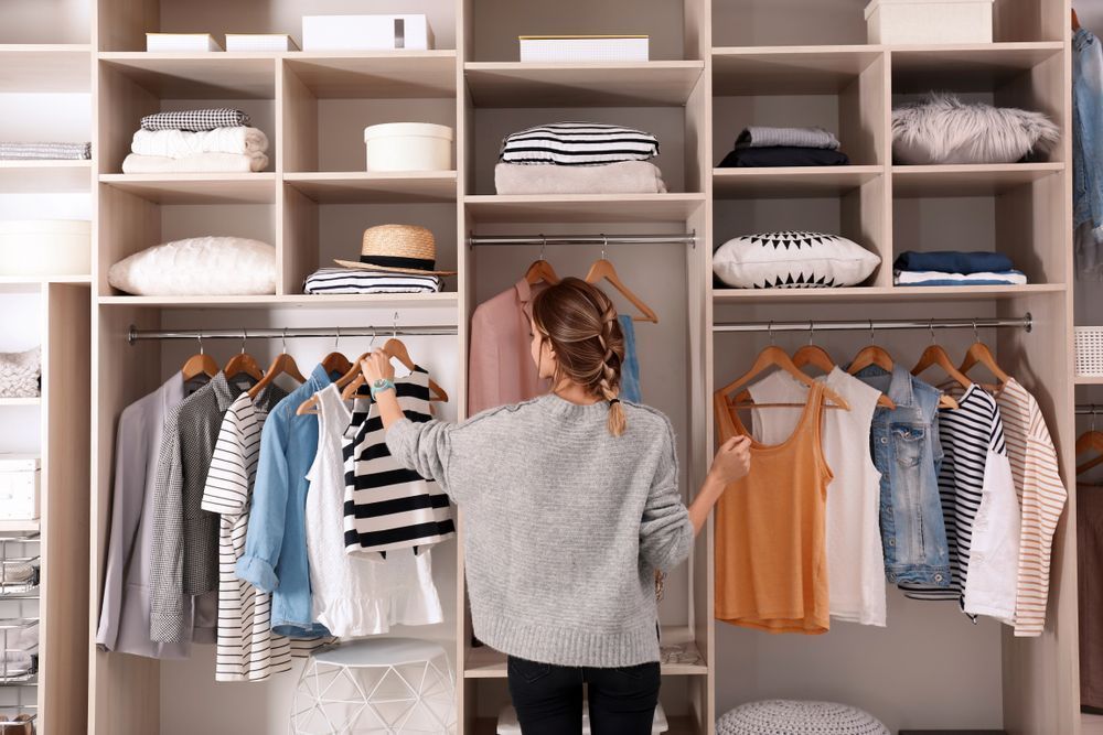 woman evaluates her wardrobe 