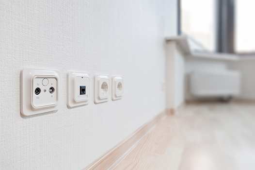 White Wall With Four Electrical Sockets — Carl Voss Electrical In Urangan, QLD