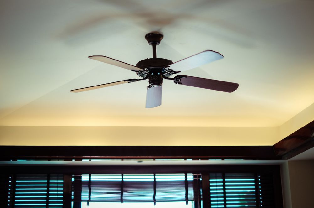 Ceiling Fan With Five Blades, Mounted on White Ceiling Above Wooden Blinds — Carl Voss Electrical In Urangan, QLD