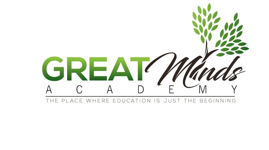 The logo for great minds academy has a tree and leaves on it.