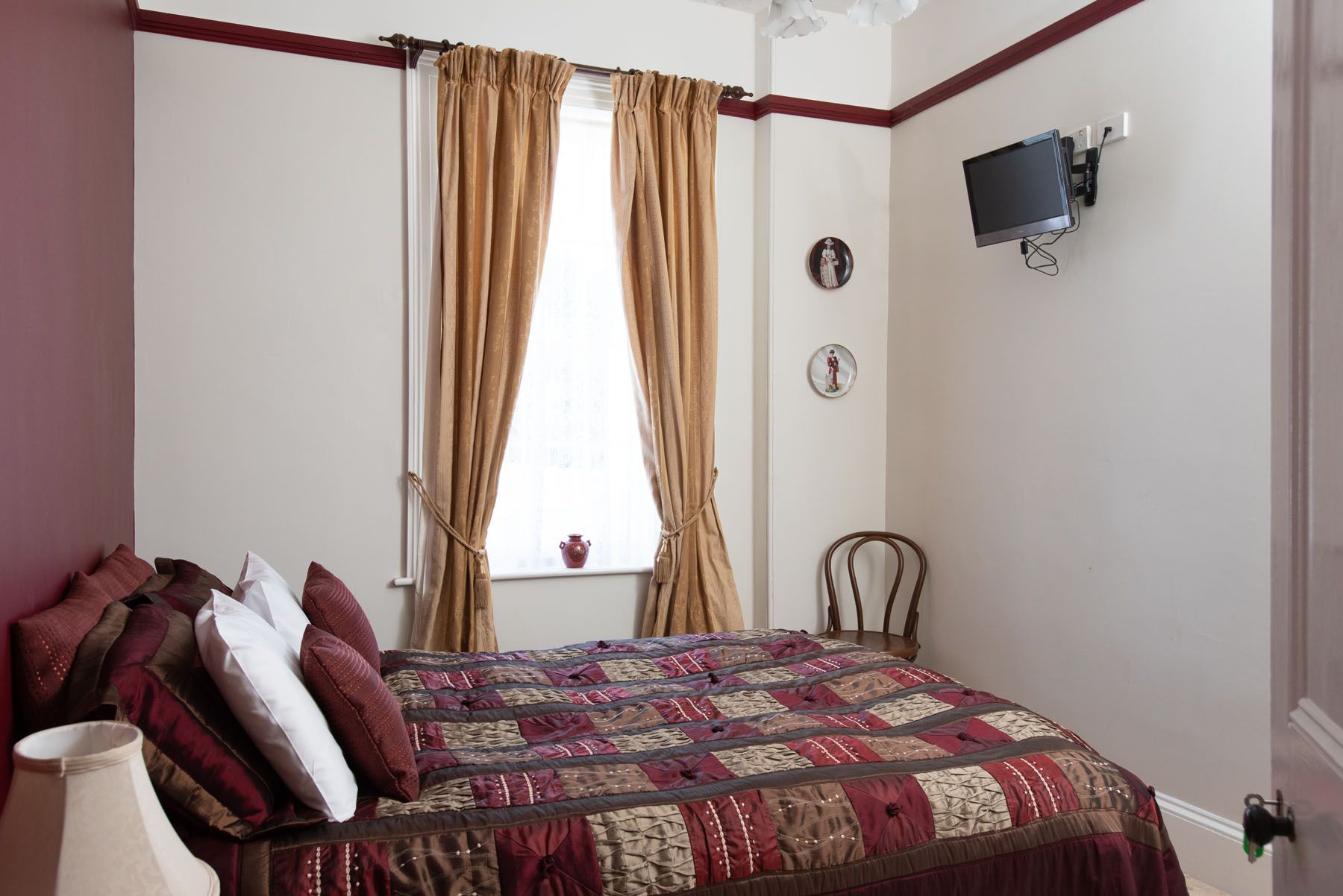 one of the bedrooms in the main house with queen bed