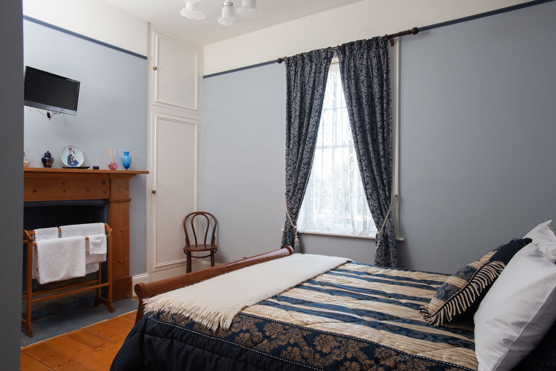 one of the bedrooms in the main house with queen bed