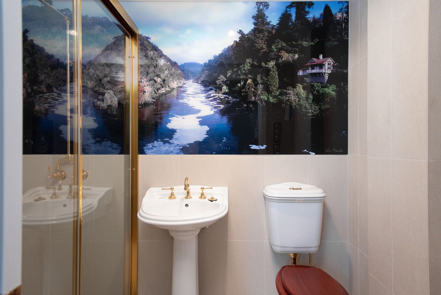 A bathroom at the fitzpatricks inn showing vanity, toilet and shower