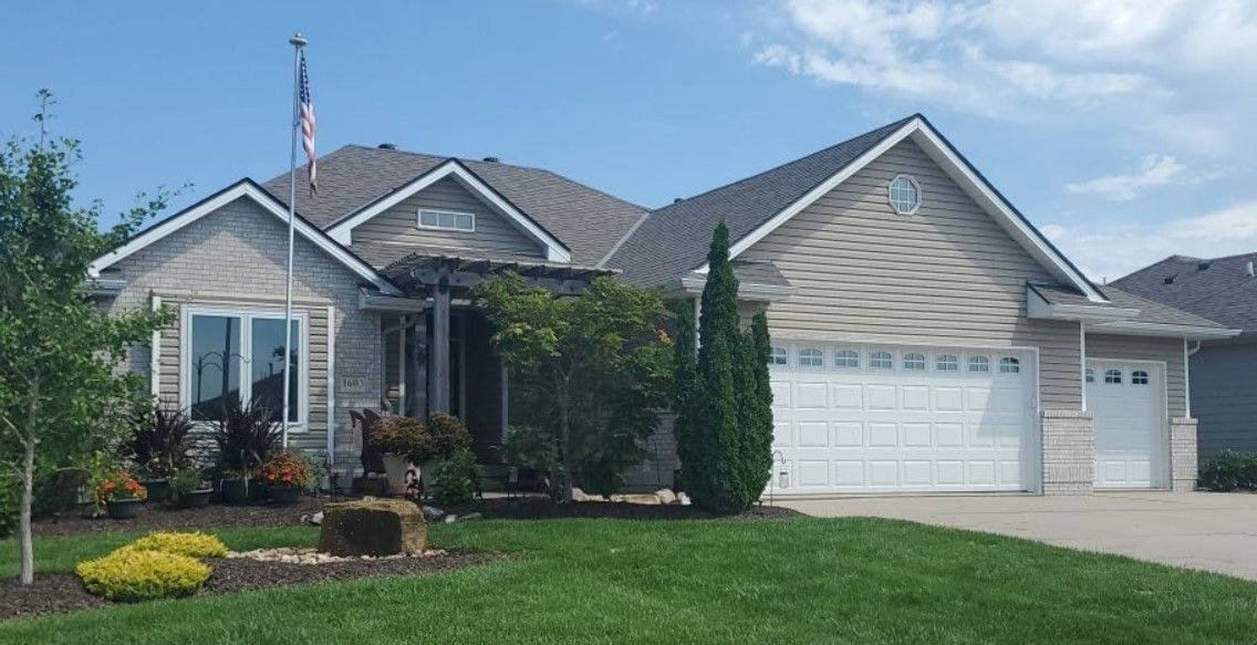 A large house with a flag on top of it