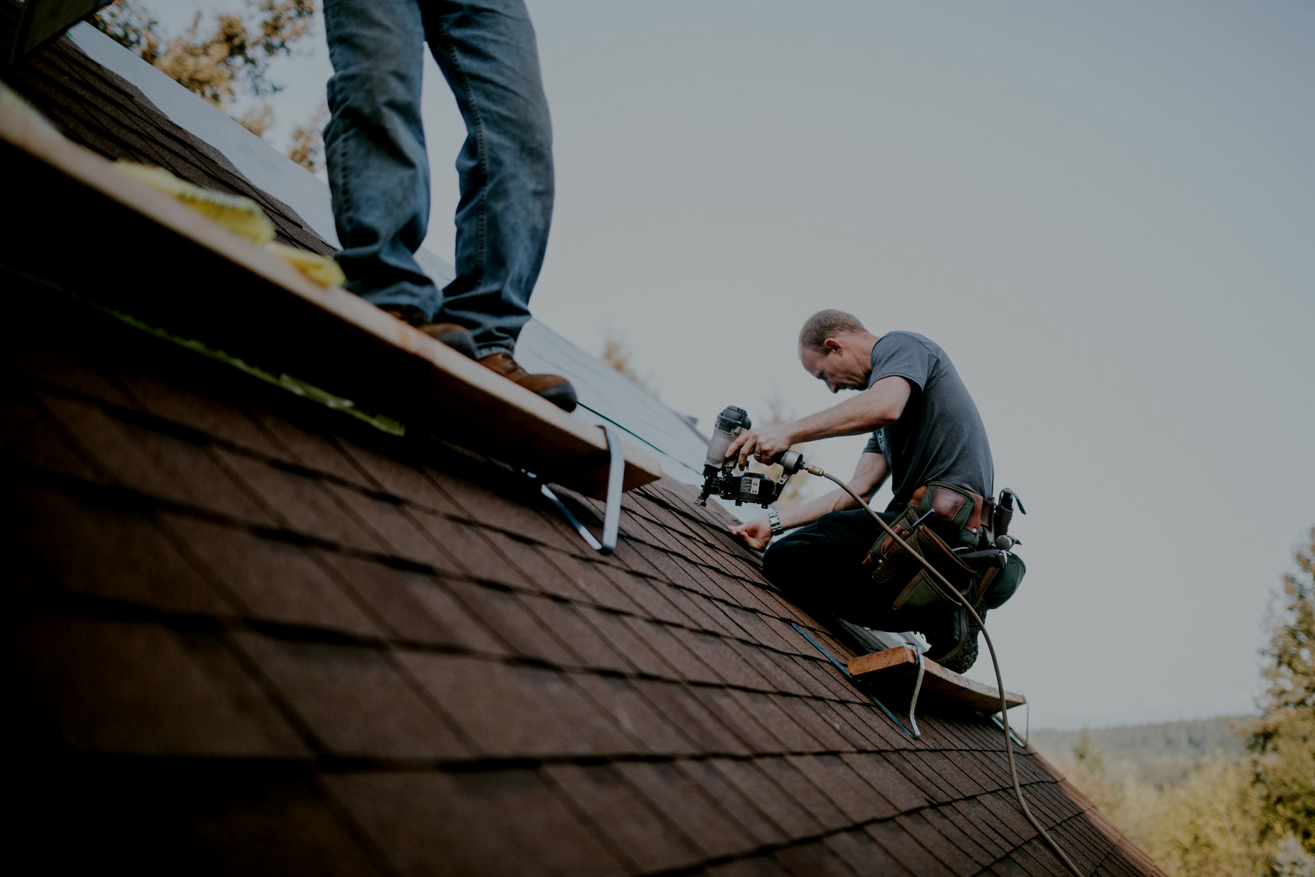 Residential roofers installing a new roof.