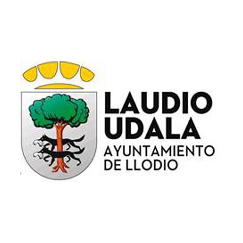 Escudo de armas de Laudium/Llodium. Árbol, dos lobos negros, corona de oro y texto: Laudio Udala, Ayuntamiento de Llodio.