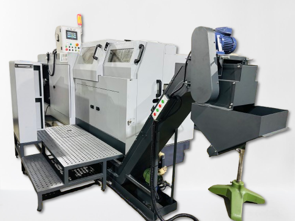 A large industrial machine with an angled conveyor belt and a waste bin in a factory setting.