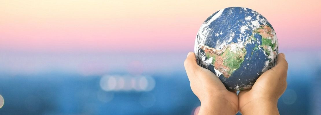 Hands Cupping a Small Earth Globe — Immigration Agents in Cairns North, QLD