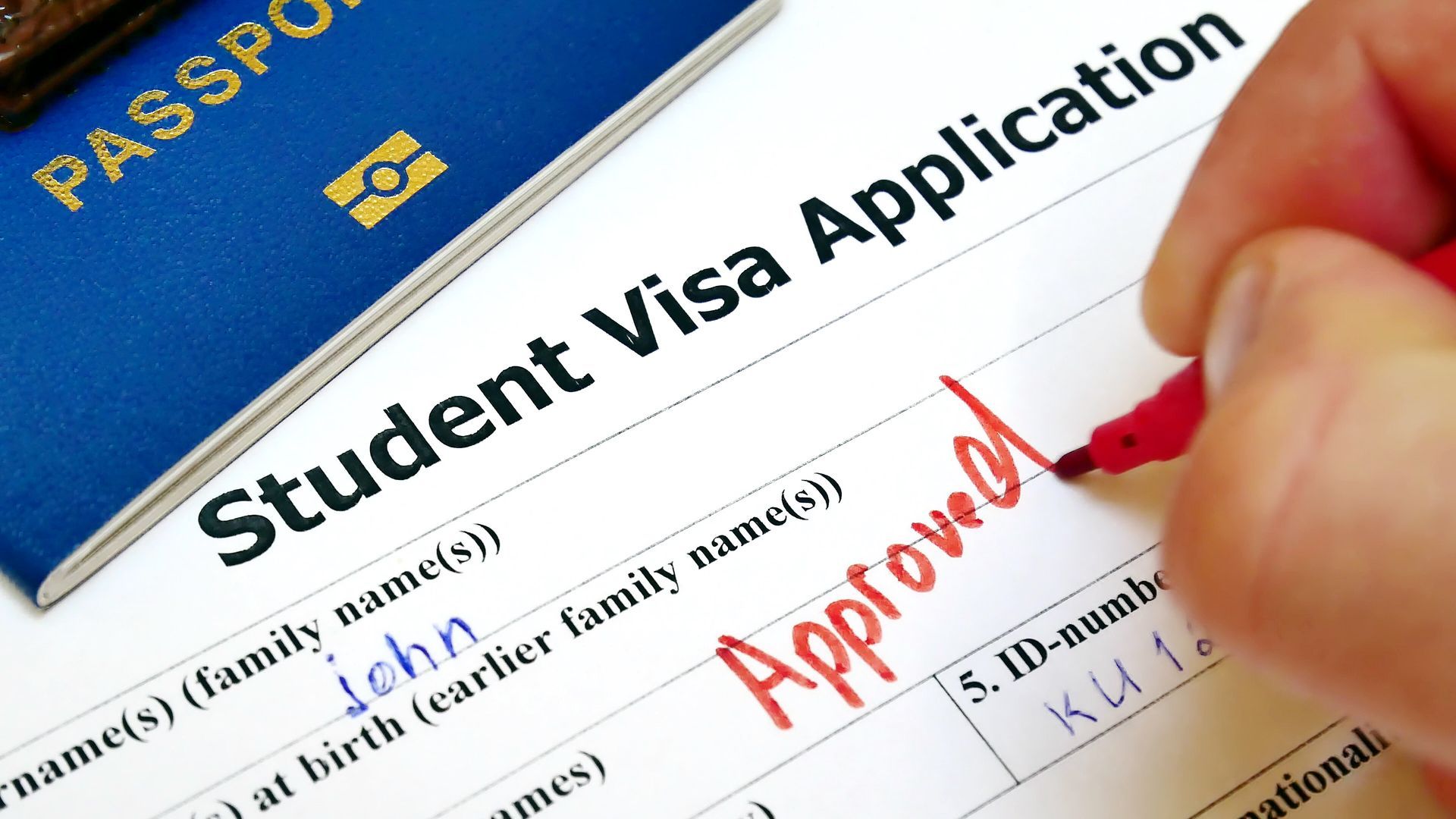 A Person Filling Out a Student Visa Application — Immigration Agents in Cairns North, QLD