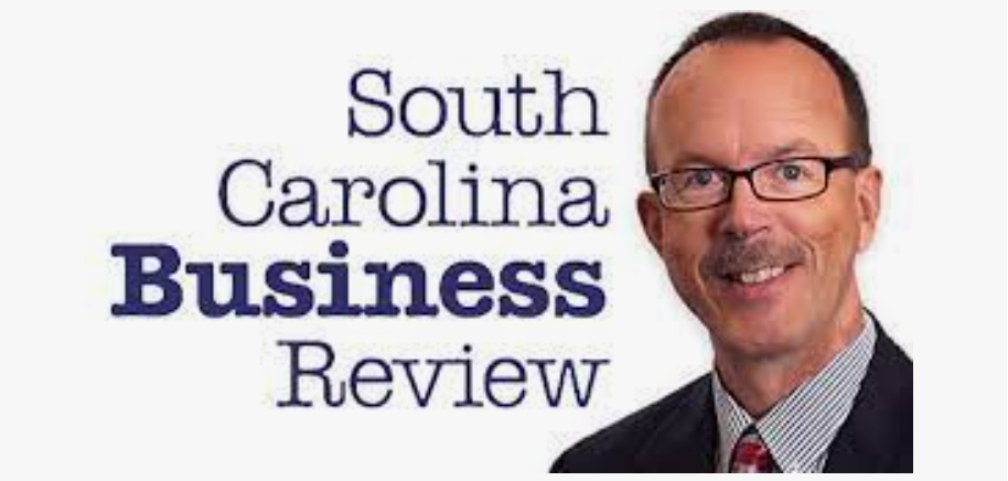 South Carolina Business Review logo with a man in glasses and suit on the right