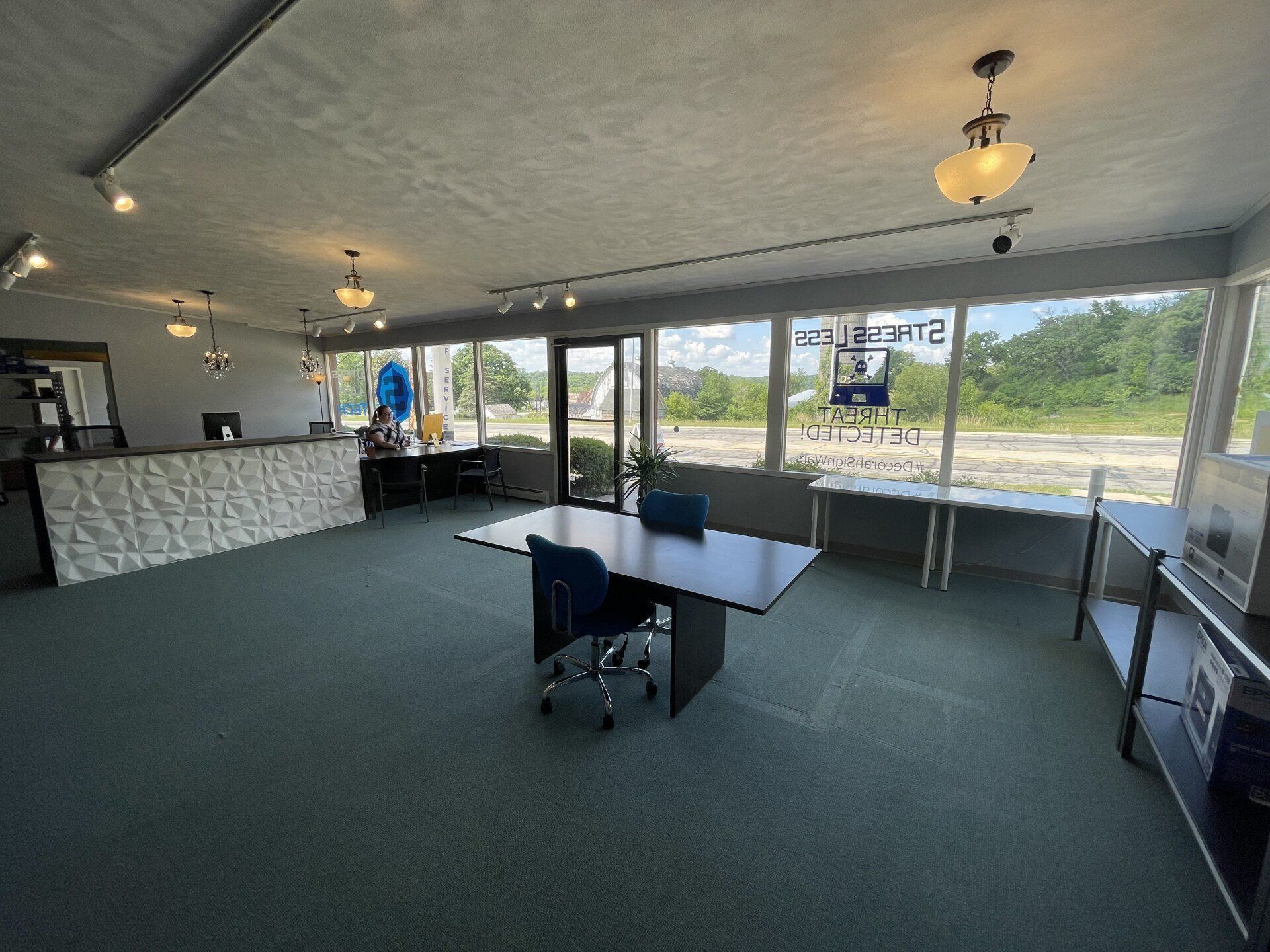 interior of stress less tech Decorah office front desk and conference table