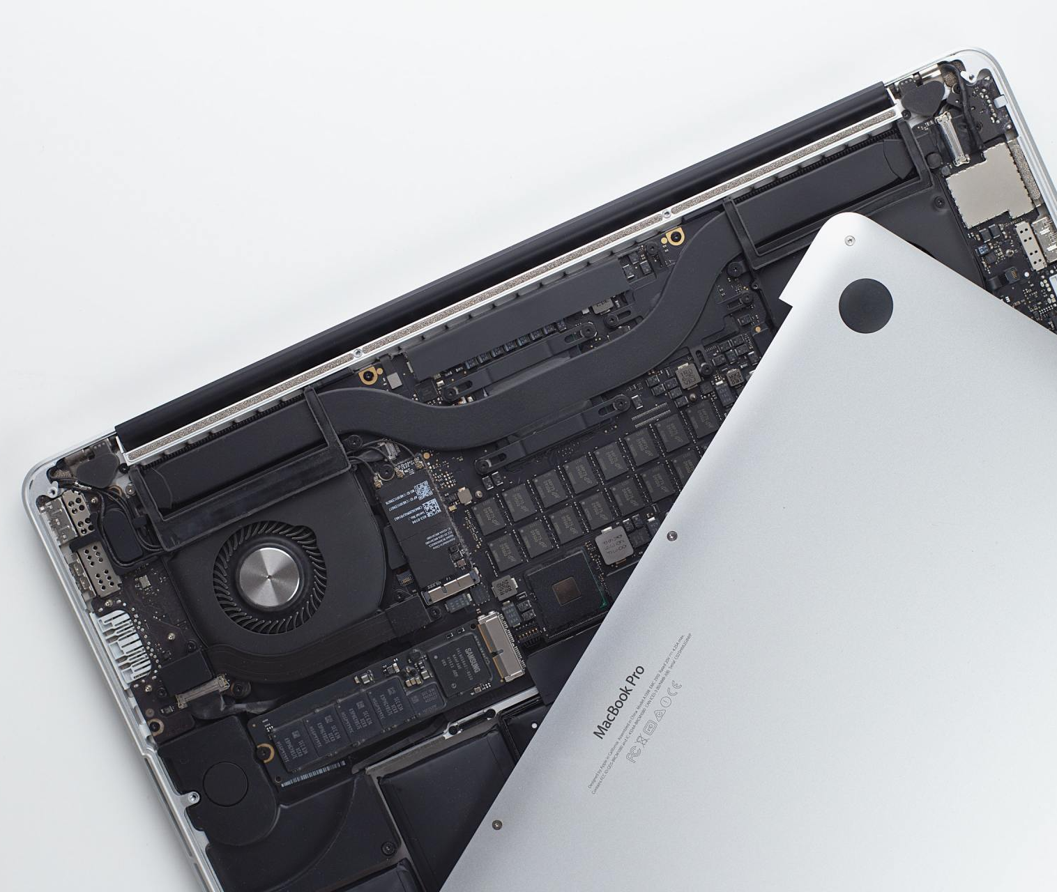 macbook pro with the cover taken off it for repair