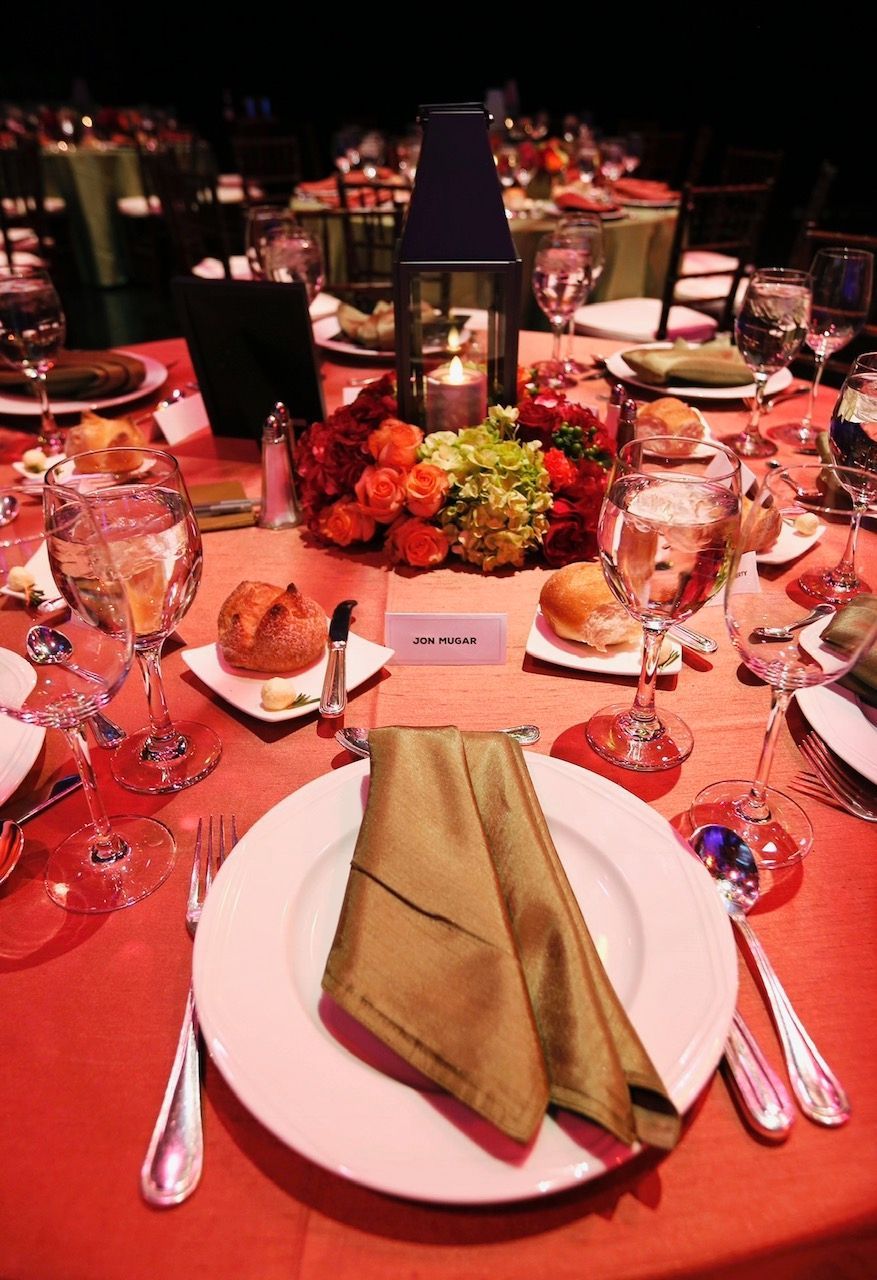 A table set for a dinner party with plates and glasses
