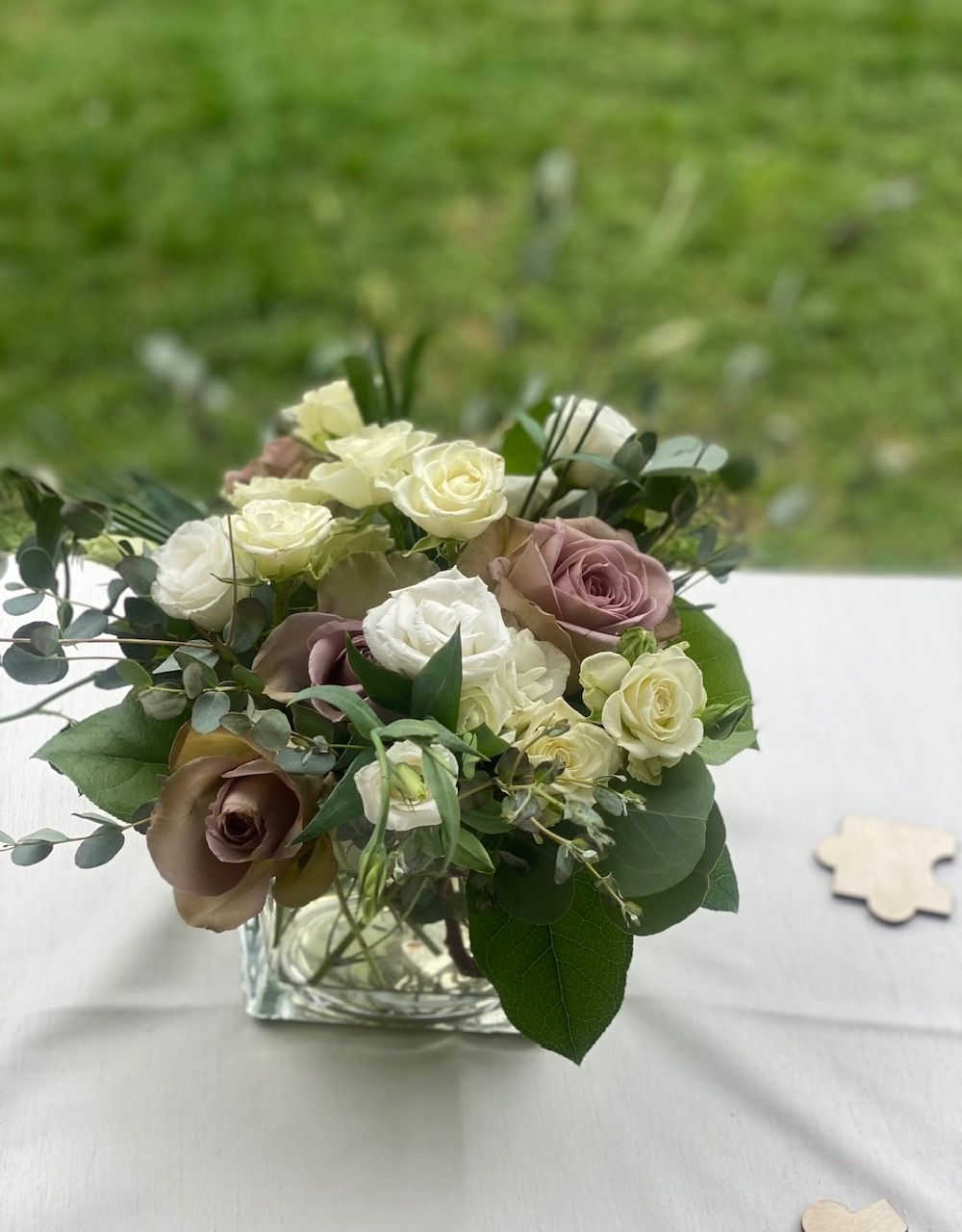A vase filled with flowers is sitting on a table.