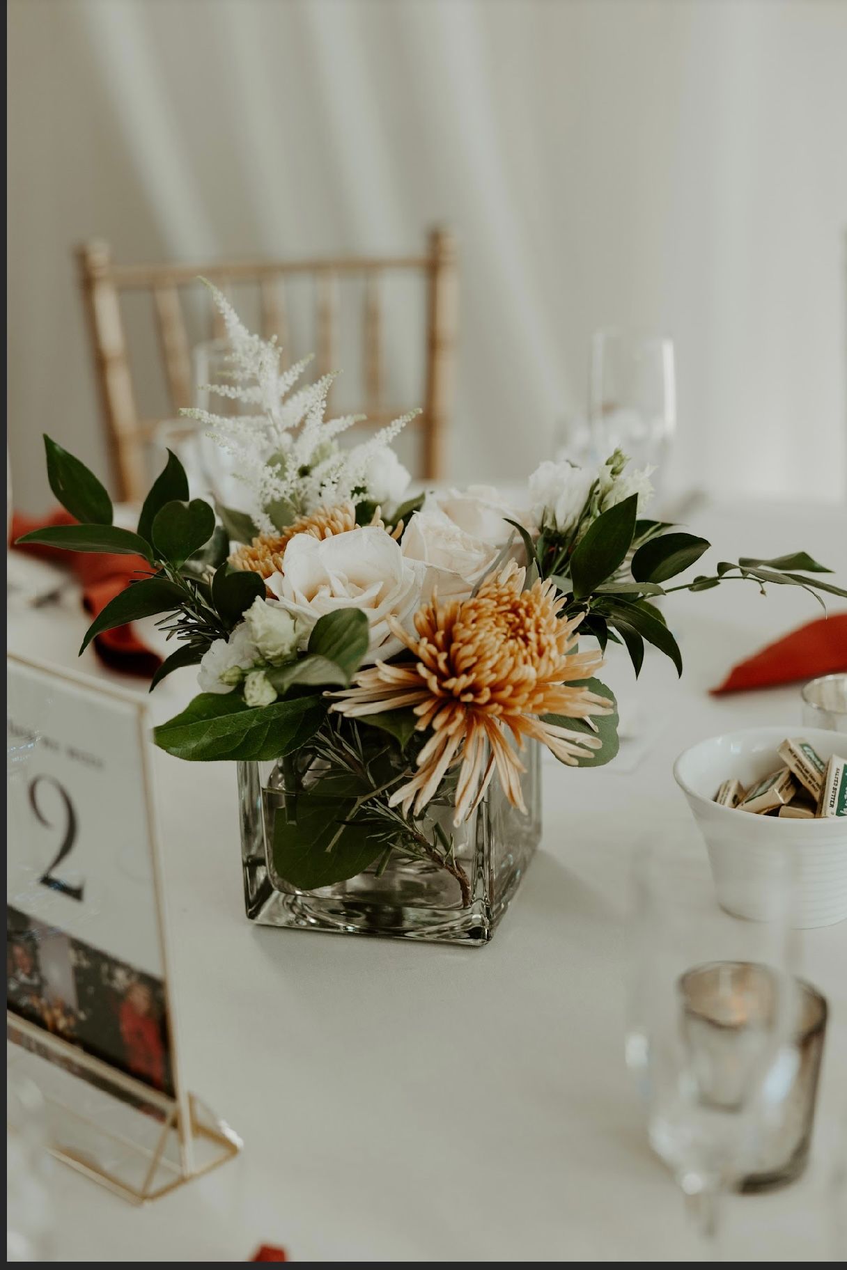 A vase filled with flowers is sitting on a table.