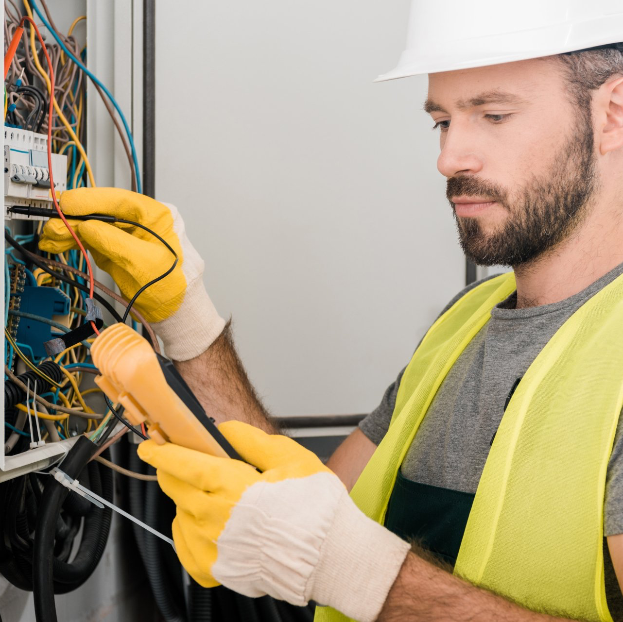 electrician working on breaker