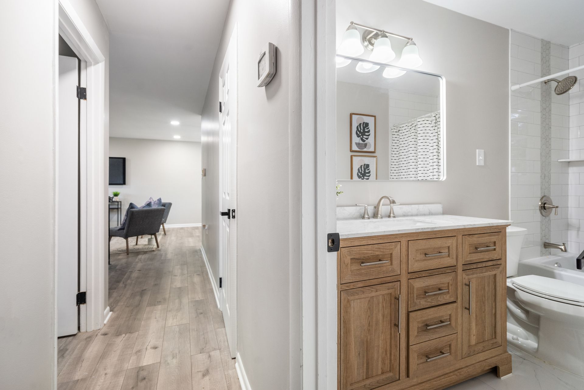 A bathroom with a sink , toilet , and mirror.