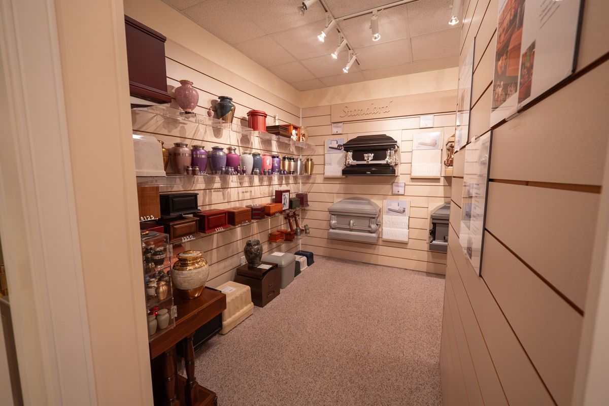 A room filled with urns and boxes on shelves