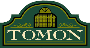 A green sign with the word tomon on it