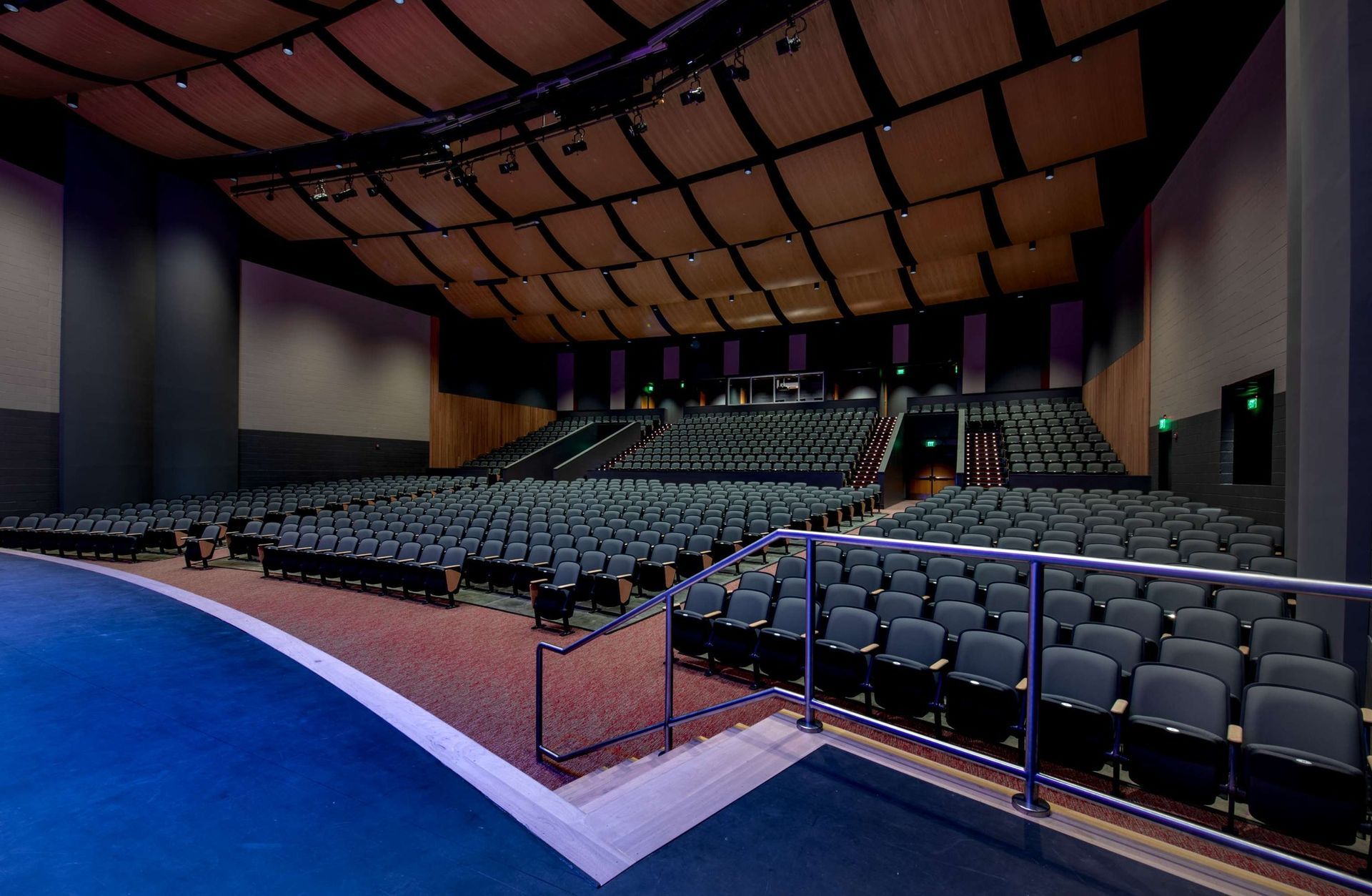 A large auditorium with rows of seats and stairs