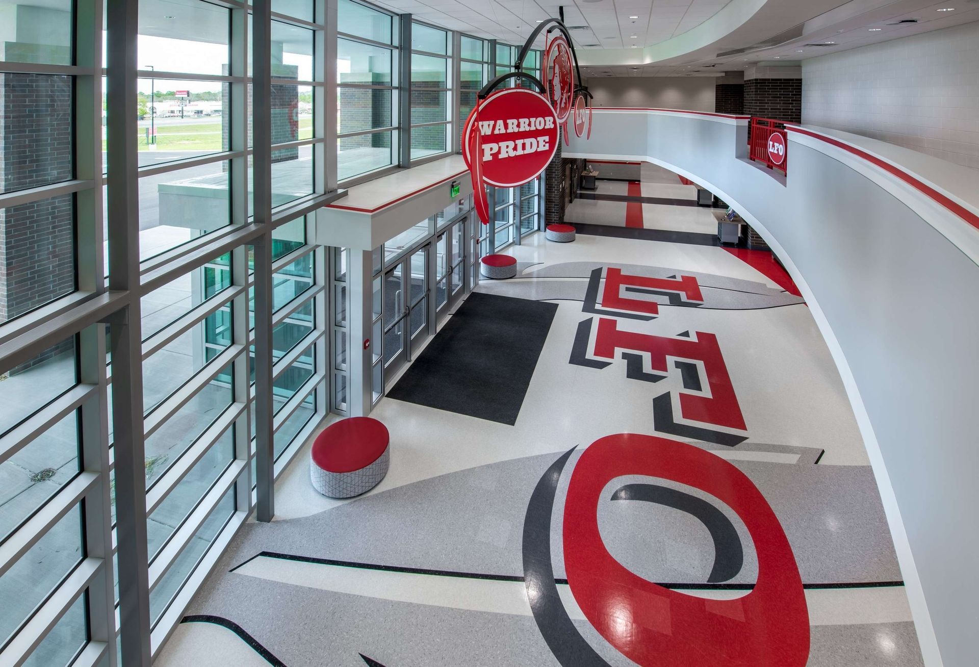 A large building with a sign that says ' coca cola ' on it