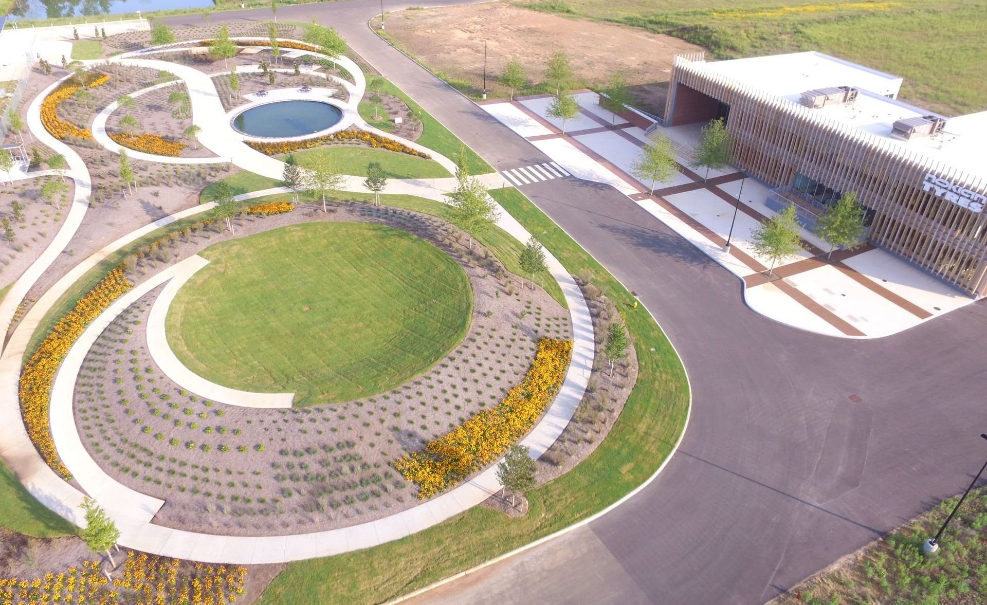 An aerial view of a park with a large circle in the middle.
