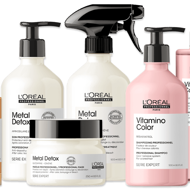 Shampoo Products Several bottles of l' oreal products are lined up on a white background