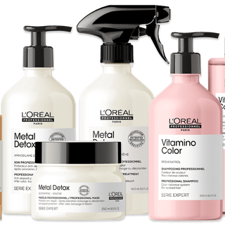 Several bottles of l' oreal products are lined up on a white background