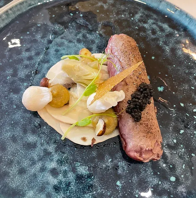 A close up of a plate of food on a table
