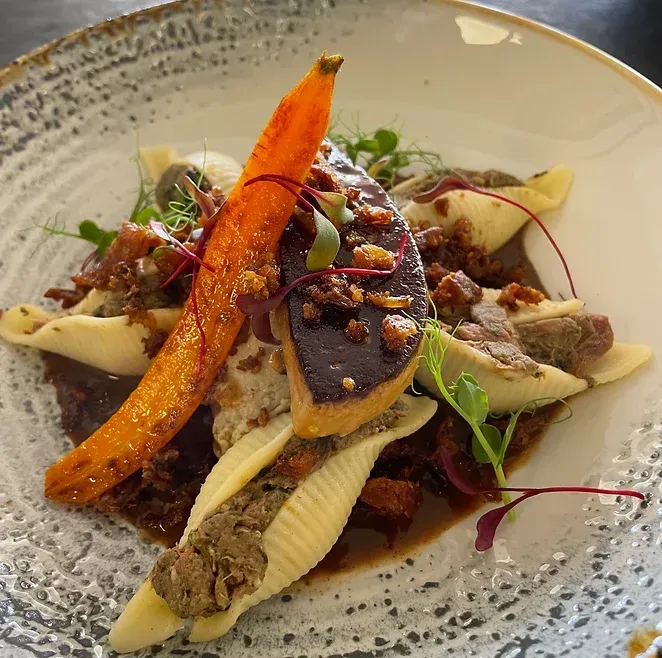 A close up of a plate of food on a table