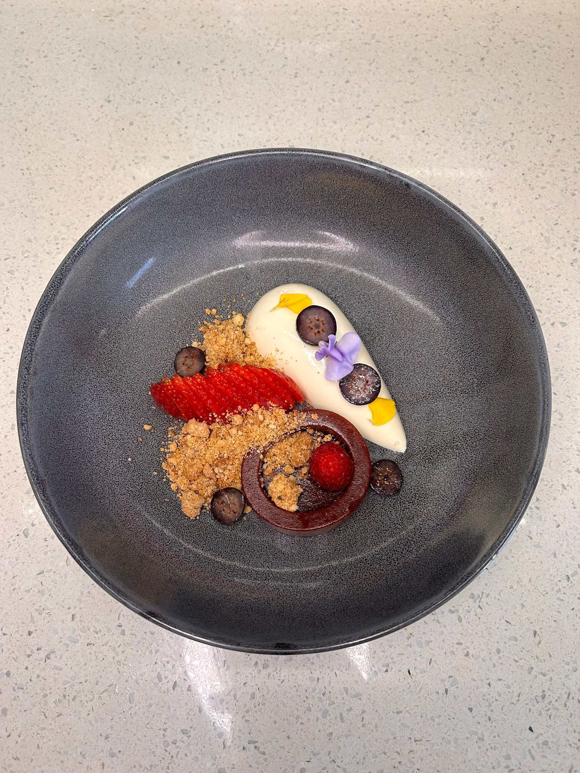 A plate of food with a swirl in the middle