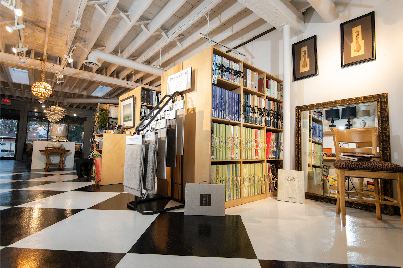 A large room with a checkered floor and shelves filled with books. A large room with a checkered floor and shelves filled with books.