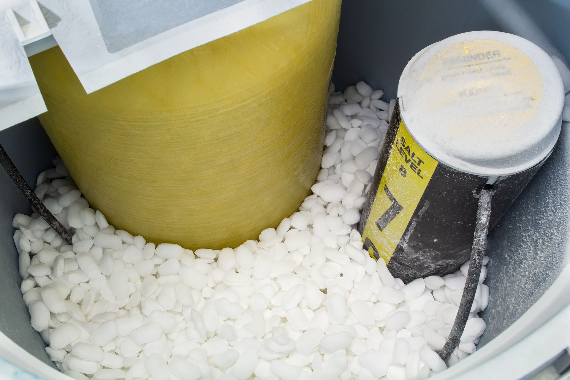 Water softener tank and salt-filled brine tank used for residential water treatment. Water softener tank and salt-filled brine tank used for residential water treatment.