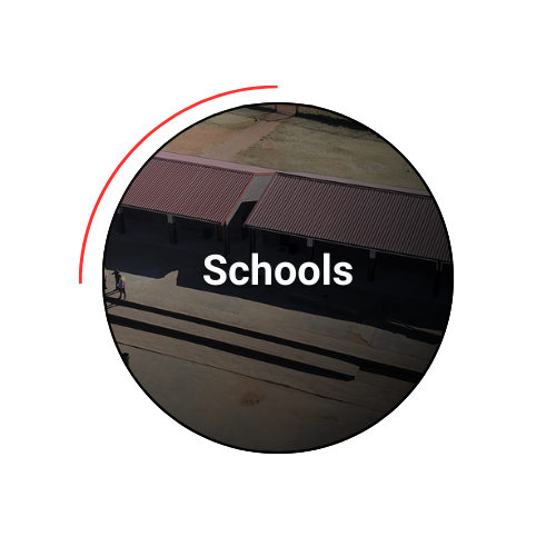 Aerial view of a school building with red rooftops, labeled 